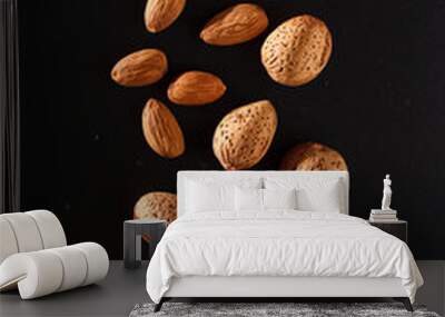 almond on black background Wall mural