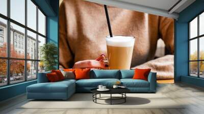 woman drinking latte macchiato coffee Wall mural