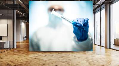 corona virus concept. male doctor demostrating test-tube Wall mural