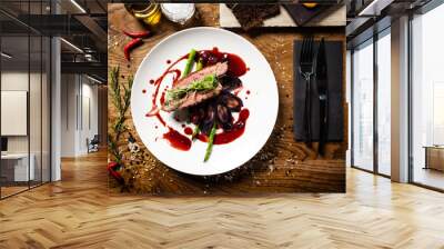 Duck breast served on a plate in restaurant Wall mural