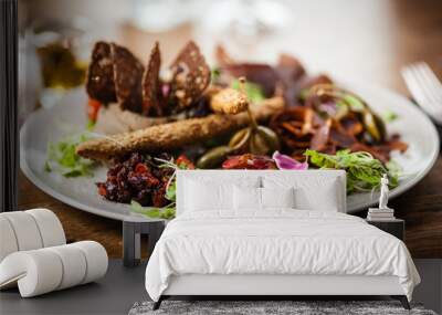 Meat platter for two served on a plate in restaurant Wall mural