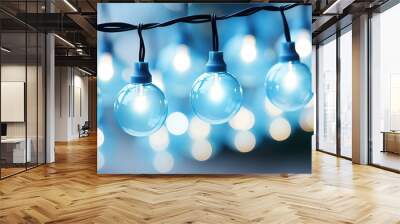 Decorative blue string lights glowing softly during a festive evening gathering outdoors Wall mural