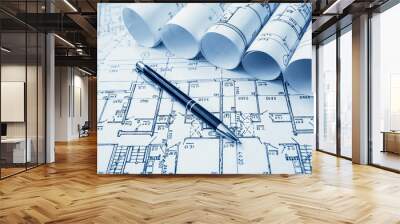 Architect workplace. Architectural project, blueprints, blueprint rolls on wooden desk table. Construction background. Engineering tools. Copy space Wall mural