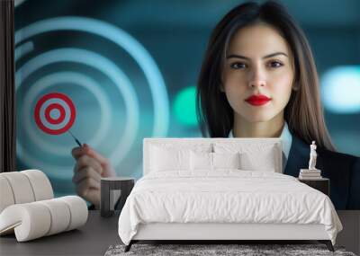 The businesswoman confidently holds a target icon, her expression reflecting determination and focus, with dynamic visuals of human development and digital marketing trends swirlin Wall mural