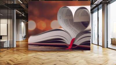 Book with opened pages in form of heart. Reading, religion and love concept. Wall mural