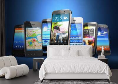 choose mobile phone. row of the different smartphones on blue ba Wall mural