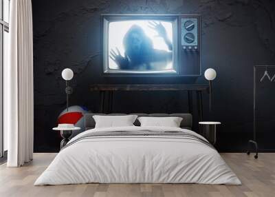 Horror scary movie concept. Ghost silhouette on screen of vintage tv in haunted house. Wall mural