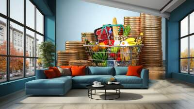 nflation, growth of food sales or growth of market basket or consumer price index concept. Shopping basket with foods and coin stacks. Wall mural