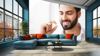 Beautiful Man Taking Pill, Medicine. Vitamins And Supplements Wall mural