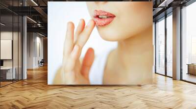 Beauty and Care. Portrait of a Young Woman with a Beautiful Skin. Beautiful Lips. Girl Takes Care of Lips. Woman with Beautiful Blue Eyes. Makeup. Lip Scrub. Peeling Wall mural