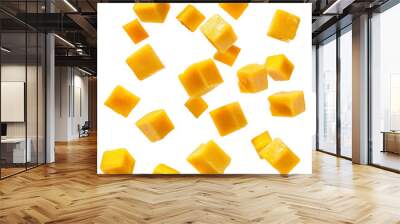 A bunch of yellow mango cubes are flying through the air Wall mural