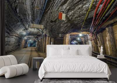 Two illuminated underground tunnels in old mine Wall mural