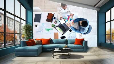 Creative, business people and meeting in office from above for marketing, analysis and statistics review. Top view, advertising and team with chart, graph or laptop for budget on project planning Wall mural