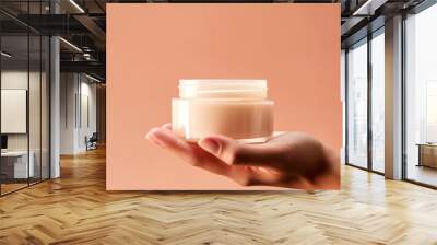 Close up of hand holding a jar of cosmetics product. Skincare hygiene moisturiser Wall mural