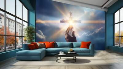 Hand holding a cross, worship God. Glowing light or spirit for spirituality and christianity Wall mural