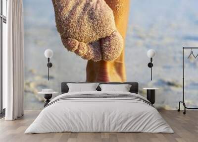 women's legs on a beach Wall mural