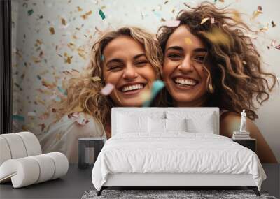 LGDT lesbian couple or girlfriends celebrating with confetti together  Wall mural