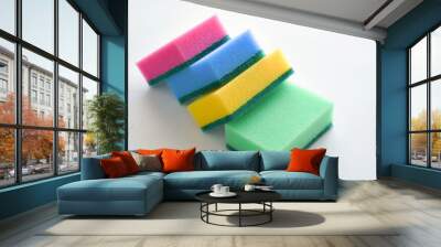 Sponges on white table. Household tools. Wall mural