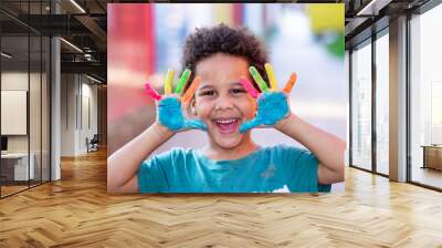 beautiful happy boy with painted hands Wall mural