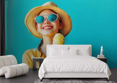  A tropical summer scene featuring a lovely girl delighting in a delicious ice cream cone as it melts on a soft blue background. Wall mural