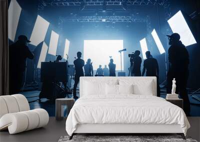 commercial video film movie making lighting set professional studio production big working people silhouette scenes behind television camera motion picture equipment crew photo light Wall mural