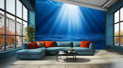 Deep ocean blue background with a single bright white spotlight focused directly downward, creating a sharp contrast with open space for your message. Wall mural