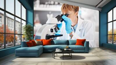 Medical, microscope and science with black woman in laboratory for experiment, research and pharmacy. Healthcare, medicine and results with expert looking for pathology, test and sample analysis Wall mural