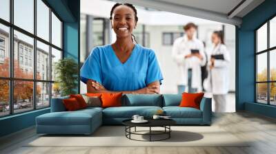 Nurse, healthcare and medicine with a woman working in healthcare for health, wellness or insurance in a hospital. Portrait of a female medical student or professional standing arms crossed inside Wall mural