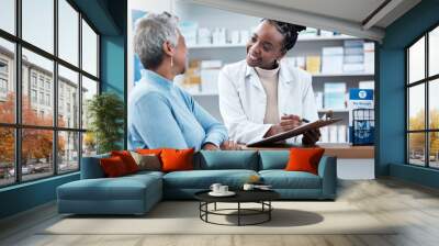 Pharmacy, healthcare or insurance with a customer and black woman pharmacist in a dispensary. Medical, clipboard and trust with a female medicine professional helping a patient in a drugstore Wall mural