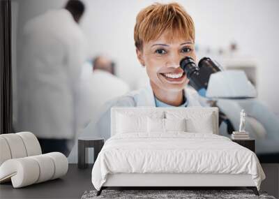 Woman, medical science and portrait with a microscope in a laboratory for research, analysis and study. Mature scientist person in lab for development, future medicine and biotechnology with a smile Wall mural