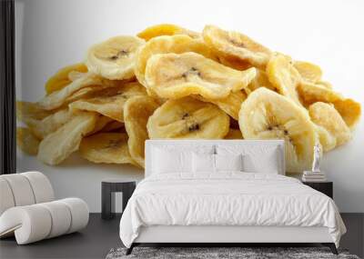 Isolated dried sweet banana chips piled together against a clean white backdrop. Wall mural