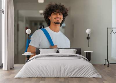 Portrait of a male college student on a university campus. Wall mural