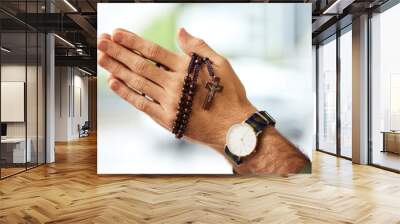 Christian man, rosary and hands praying for spiritual faith, holy gospel or worship God at church. Closeup, prayer beads and cross for support of religion, culture and praise of jesus, heaven or hope Wall mural