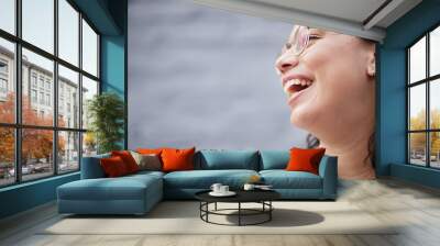 Laughing, funny and face of a woman with a smile for happiness, motivation and positive mindset. Closeup, zoom and a happy female person with cosmetics, confidence or idea on blurred background space Wall mural