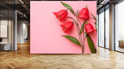 Top view red natural bellflowers with green leaf on pastel colored pink background, botanical blossoms scenic, minimal flat lay. Beautiful nature delicate wild flowers, summer flowering concept   Wall mural