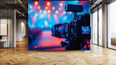 Silhouette of filming gear against bright conference stage Wall mural