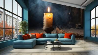 candles burning in a dark and eerie room Wall mural