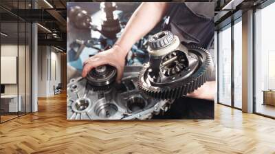 cross-section of a car gearbox. mechanics work in the garage. hand mechanic in working clothes Wall mural