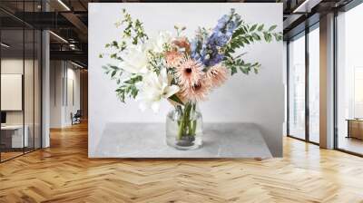 Finished flower arrangement in a vase for home. Flowers bunch, set for interior. Fresh cut flowers for decoration home. European floral shop. Delivery fresh cut flower. Wall mural