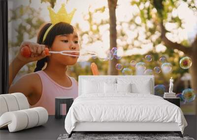 boy playing with soap bubbles Wall mural