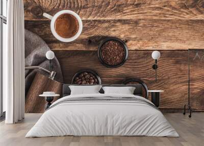 Manual Coffee grinder and jars of fresh ground coffee from roasted beans on wooden rustic table. Banner... Wall mural