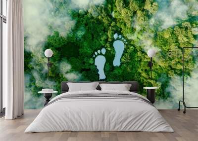 A lake in the shape of human footprints in the middle of a lush forest as a metaphor for the impact of human activity on the landscape and nature in general. 3d rendering. Wall mural