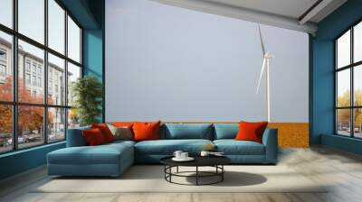 Concept of wind generator in the field, clean ecological energy production, background for copy space. Wall mural