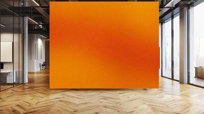 Gradient abstract orange background with a textured grainy surface Wall mural