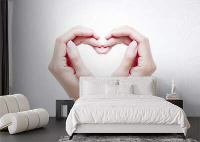 Hands making heart shape isolated on a yellow background , Love and minimal fashion. Wall mural