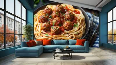 A plate of spaghetti and meatballs with tomato sauce, garnished with parsley, and served with two forks and cherry tomatoes. Wall mural