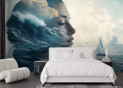 A woman's profile is superimposed with an ocean wave, with a sailboat in the distance. Wall mural