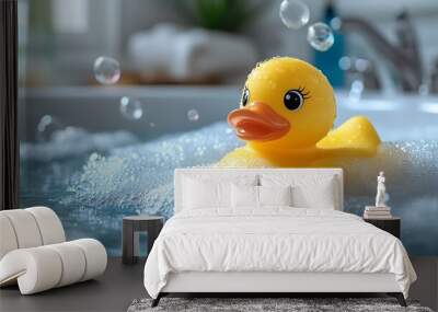 A yellow rubber duck floats in a bathtub full of bubbles, surrounded by water and foam. Wall mural