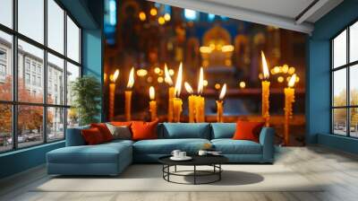 Many burning wax candles in the orthodox church or temple Wall mural