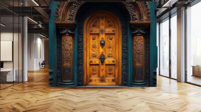 Ornate wooden door with intricate carvings, set within an arched doorway, framed by teal walls and columns. Wall mural